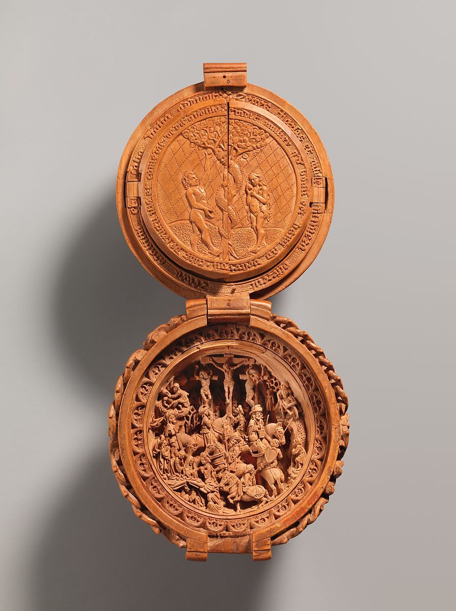 Adam and Eve and the Crucifixion are two of the scenes carved into the bead.
