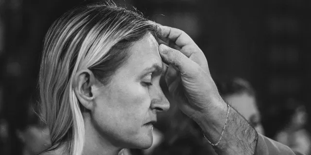 Are ashes sprinkled or traced on the head on Ash Wednesday?